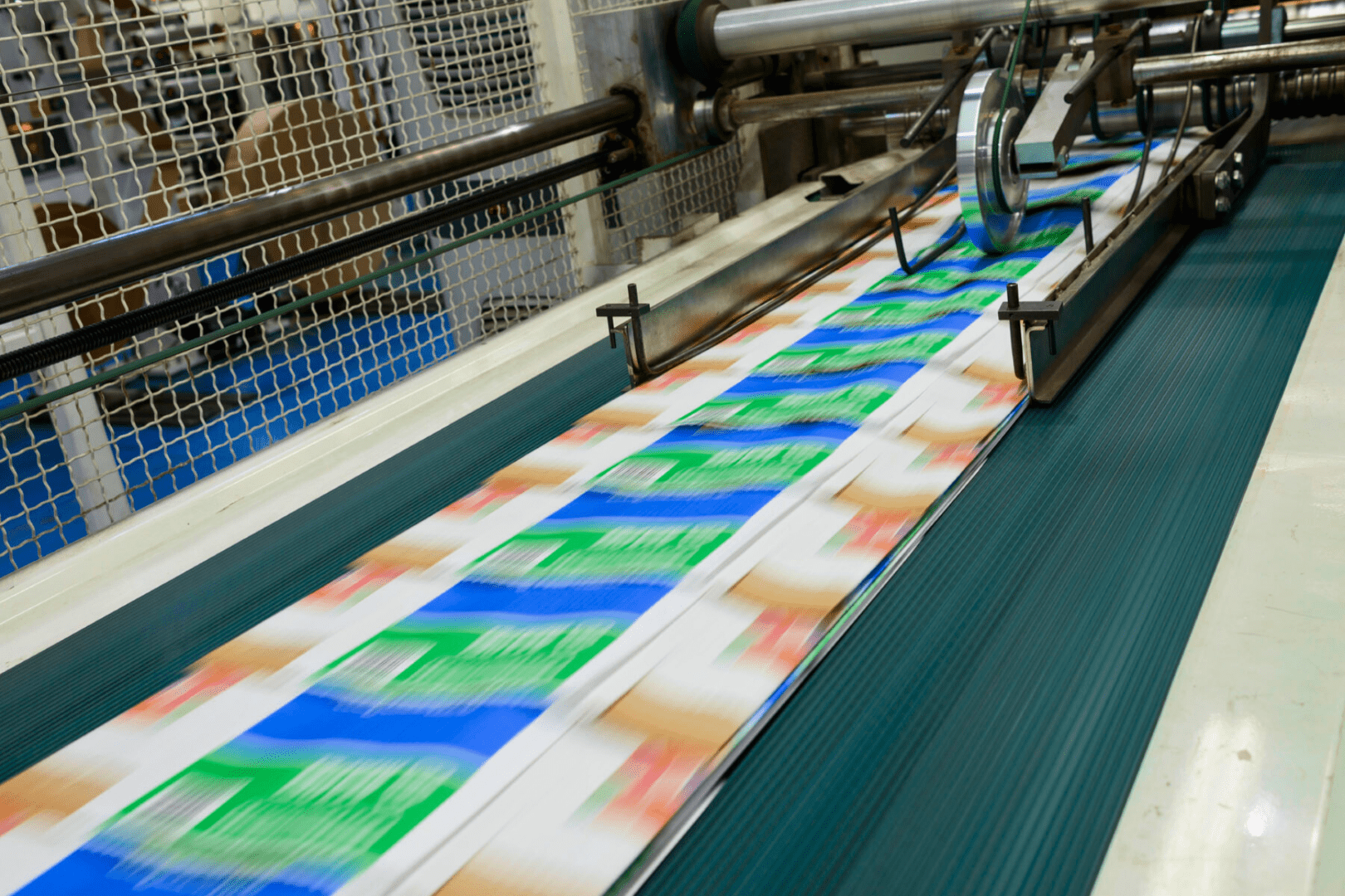 Manufacturing packaging shown during high-speed printed film run for industrial sack and bag production.