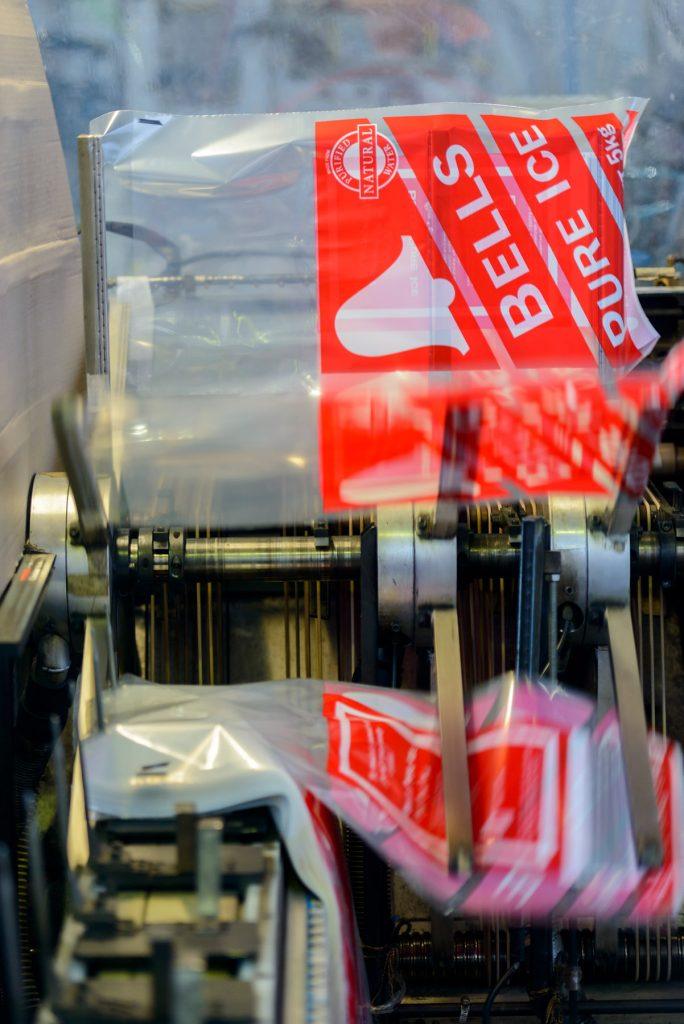 Bells Ice Bag on machine Shelf-ready display featuring gusseted base and wicket bag style converted bags for retail visibility.