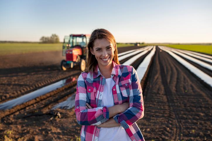 Smiling Female sales rep in the field.