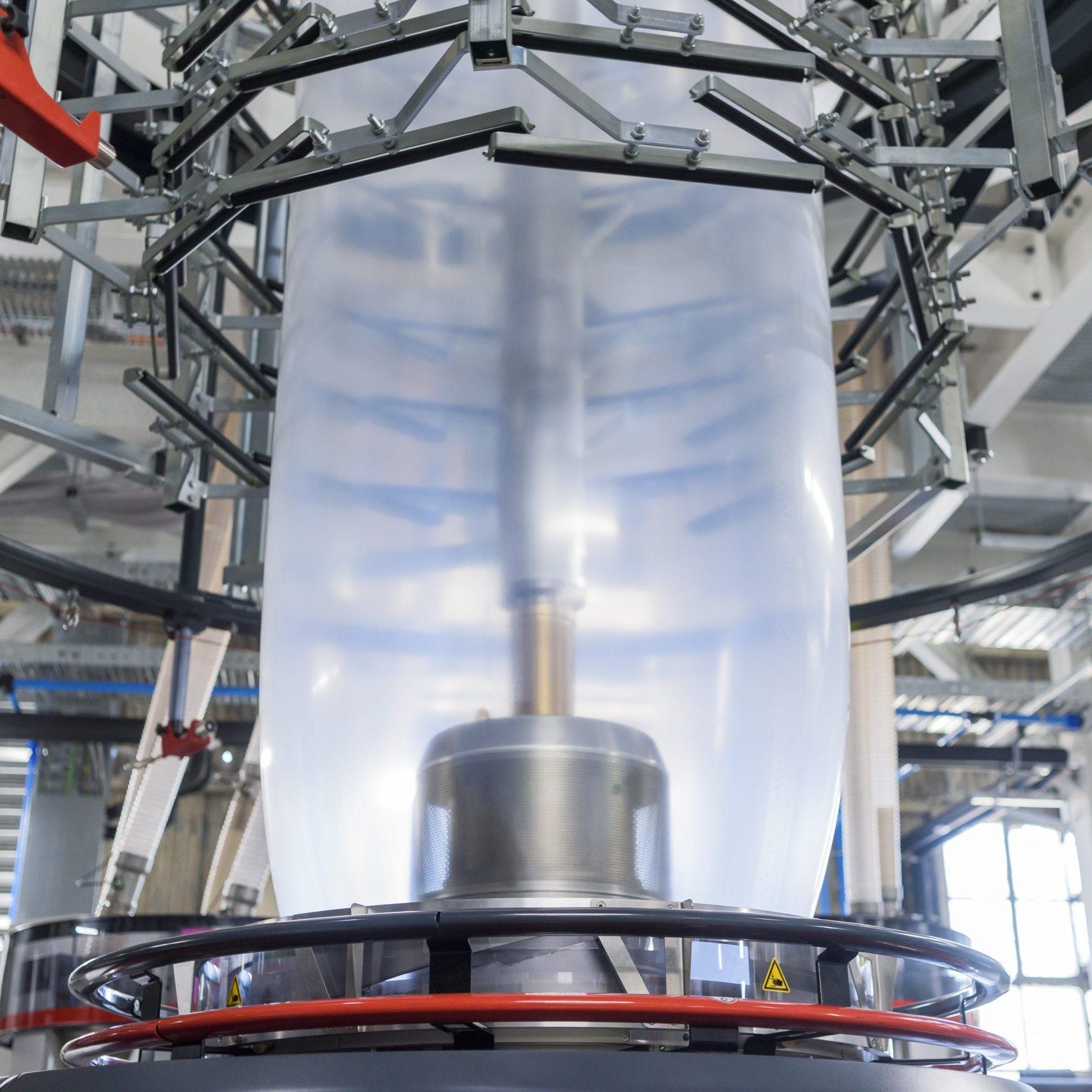 Extruder Close up Extruded film machine with multi-layer design for strength and eco efficiency.